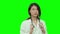 Asian female doctor thinking on Green Screen