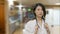 Asian female doctor worried in hospital corridor