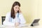 Asian female doctors provide telephone counseling in health care,new normal and coronavirus protection concept