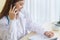 Asian female doctors provide telephone counseling in  health care,new normal and coronavirus protection concept