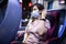 Asian female passenger wearing protective mask while traveling in the public transport by bus,Coronavirus pandemic,protection in