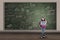 Asian female student standing at written board