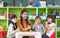 Asian female teacher and mixed race kids thumbs up in classroom,Kindergarten pre school concept.