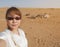 Asian female tourist taking selfie at Wahiba desert in Oman with