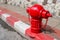 Asian fire hydrant on street. Typical red fire hydrant asian on street.