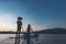 Asian fisherman on the his boat waiting to fish in the Mekong. During the twilight