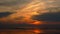 Asian fishermen walking on the beach at low tide, silhouette of two people at sunset