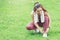 Asian fitness woman exercising in the park.Female  runner woman tying laces before working out in the morning