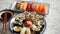 Asian food assortment. Various sushi rolls placed on ceramic plates