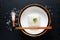 Asian Food concept cooked Thail jasmine rice long grain rice in ceramic bowl and bamboo tray on black slate board background with
