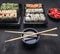 Asian food delivery home, sushi sets in plastic containers soy sauce and chopsticks