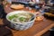 Asian food in a plate, rice noodles soup, street food