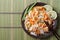Asian food: rice noodles with chicken, shrimp and vegetables
