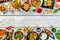 Asian food served on wooden table, top view, space for text