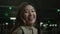 Asian funny happy ethnic 20s woman joyful pretty girl looking at camera laughing in dark night parking lot young chinese