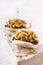 Asian fusion vegan white soft bao with meat alternative, mayo and crunchy spicy peanuts