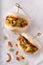 Asian fusion vegan white soft bao with okra, spicy coconut flakes, mayo and spring onion