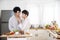 Asian gay couple homosexual cooking together in the kitchen prepare fresh vegetable make organic salad healthy food. Asian people