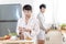 Asian gay couple homosexual cooking together in the kitchen prepare fresh vegetable make organic salad healthy food. Asian people