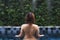 Asian girl in blue private pool in the garden