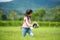 Asian girl bright running and enjoy in the field meadows outdoors, adventure and tourism for destination leisure trips for educati