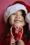 Asian girl with candy canes and santa hat