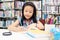 Asian girl and children writing and reading books for education