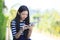 asian girl and computer tablet in hand standing with toothy smiling face use for people and internet connecting ,communication in