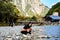 Asian Girl count river rock with a beautiful background of the center of Kamikochi national park by snow mountain, rock, Azusa riv