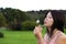 Asian girl with dandelion