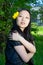 Asian girl with dandelion flower in hair