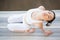 Asian girl doing Yoga in backward bending pose with eyes closed