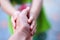 Asian girl hand  holding mother`s hand , support with warm love in family relationship
