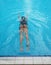 asian girl having afternoon swim in pool