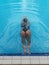 asian girl having afternoon swim in pool