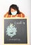Asian girl in medical mask above coronavirus