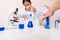 Asian girl playing as a scientist to experiment with laboratory equipment