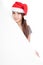 Asian girl with red santa hat with oblique blank sign