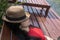 Asian girl in the resort in red clothes and hat sleep on bed pool., background