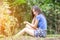 Asian girl sit down path in Bamboo forest