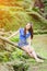 Asian girl sit down path in Bamboo forest