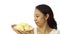 Asian girl smelling stinky durian. Smelly fruit of tropical area