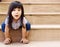 asian girl smile sitting on yellow stairs