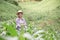 Asian girl standing and smiling in her corn field, Happy Farmer Concept