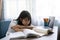 Asian girl studying homework online lesson at home