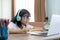 Asian girl studying homework online lesson at home