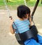 Asian girl on swing