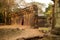 Asian Girl in Traditional Dress by an Ancient Temple Wall in Angkor Thom