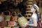 Asian girl, travel and shopping in traditional basketry shop