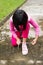 Asian girl tying shoelace